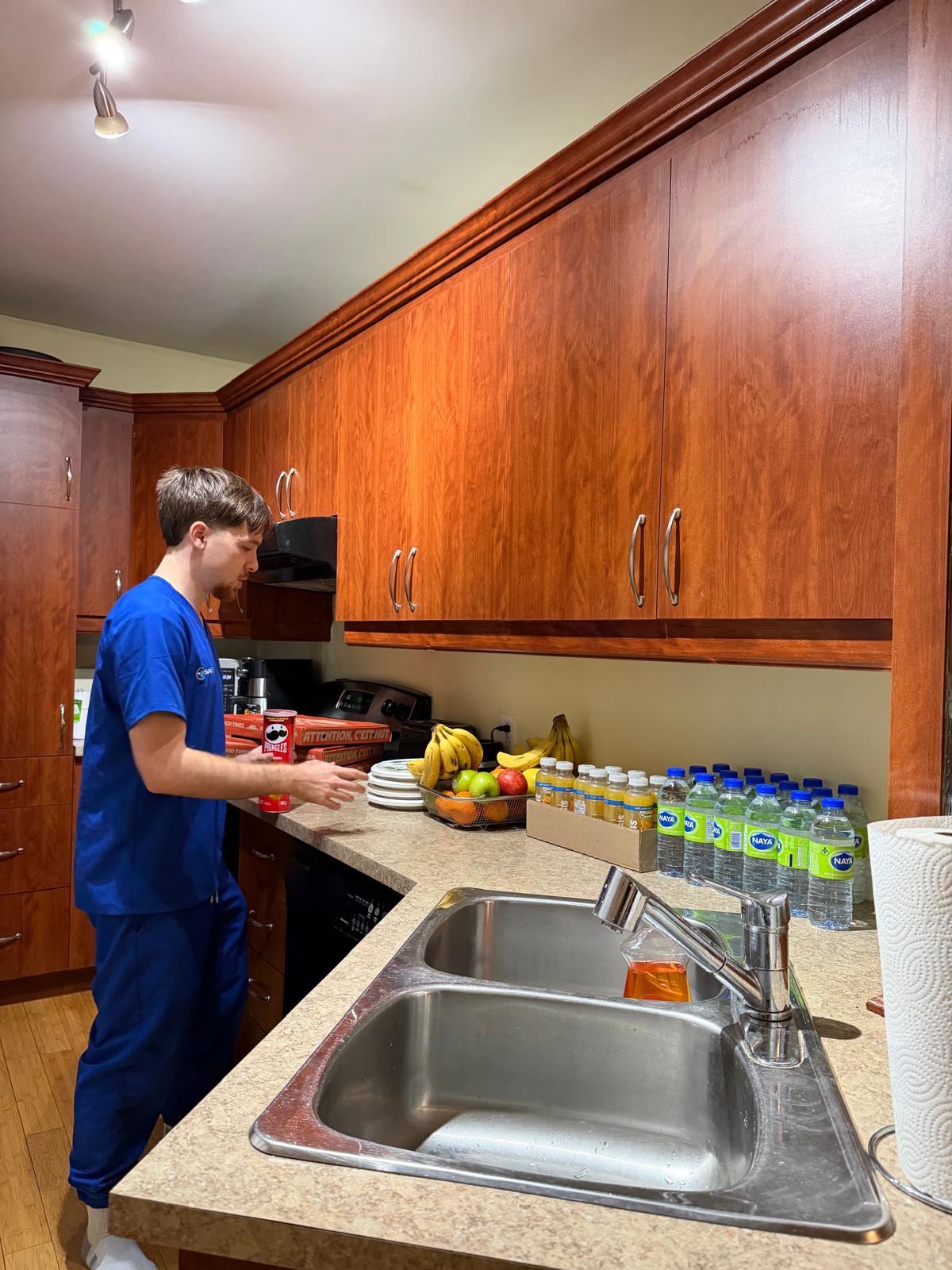 SonoRAY participant preparing refreshments in the shared accommodation kitchen area
